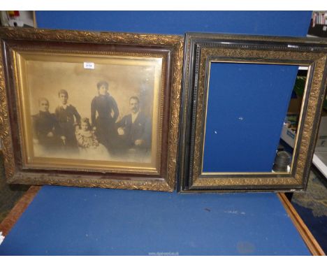 A bronze finished framed photograph of a Victorian family and another 19th century ebonised and gilt frame, 24 1/2" high x 28