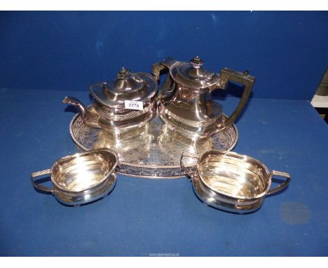 A quantity of EPNS to include tea and coffee pot with bakelite handles, sucrier and milk jug, all on button feet and on an ov