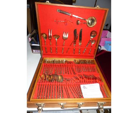 A Thai bronze canteen of cutlery in fitted box.