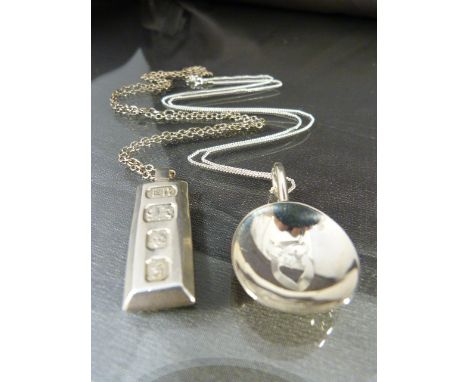 Small hallmarked caddy spoon on silver chain by Marson & Jones, Birmingham 1923 along with a silver Ingot on chain London 198