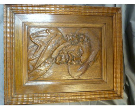 Carved oak portrait of a cavalier 