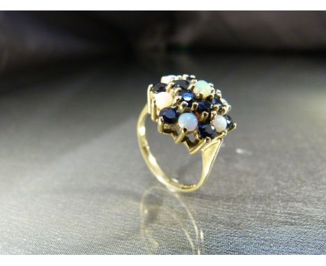 Vintage 9ct (1975) Gold Opal and Sapphire cluster dress ring. 7 Cabachon opals approx 3mm in diameter and 12 approx 3mm in di