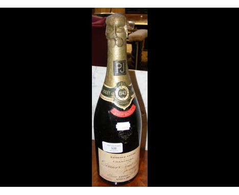 A 1943 vintage bottle of Reserve Cuvee Champagne CONDITION REPORTWhen inverted, there is a one centimetre gap between level a