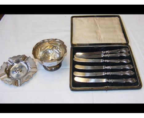 A silver bowl, ashtray and silver handled butter knives 