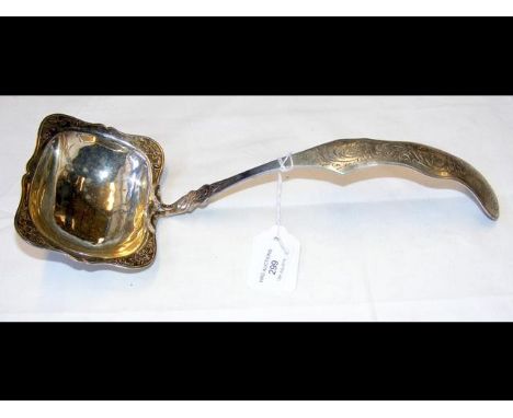 A continental white metal engraved serving ladle 
