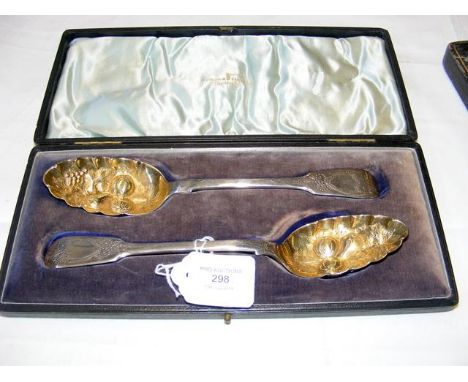 A pair of silver berry spoons in presentation case by Walker & Hall 