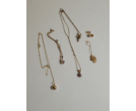 Three 9ct gold chains, one with a ruby and diamond flower pendant and a CZ pendant. Together with a 9ct gold necklace and ear