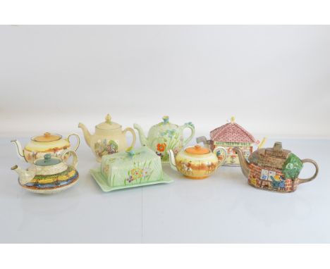 Seven ceramic teapots, including Beswick, Leonardo , Toby, together with a Beswick butter dish (7)