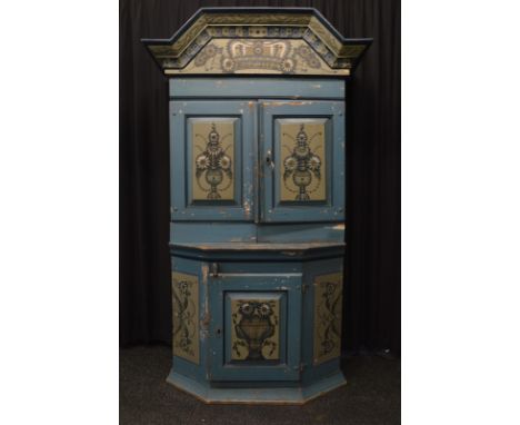 A Swedish pine painted kitchen cabinet, with panelled double door, having floral spray decoration to front, opening to reveal