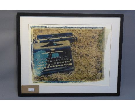 A limited edition lithograph of a typewriter, singed and numbered 72/250 in pencil. 39cm x 52cm