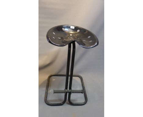 A tractor seat stool, H:73cm