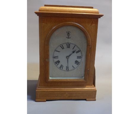 An early 20th century American mantle clock, silvered Roman dial and chime/silent sub dial, with Westminster chime, having ar