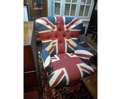A Contemporary button back armchair with Union Jack upholstery, raised on turned legs and castors, H. 106cm