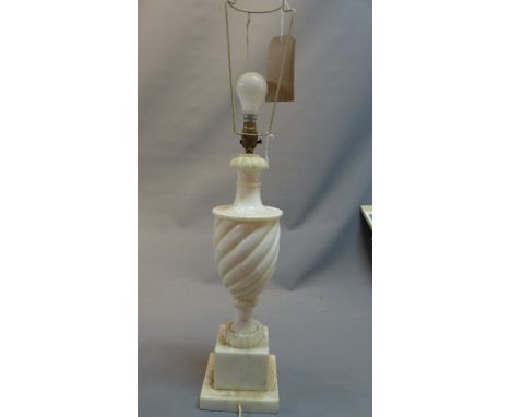 A 20th century marble table lamp in the classical taste, raised on a stepped base 