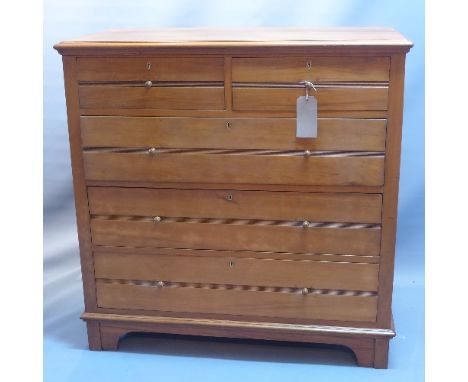 An early 20th century walnut and satinwood chest of two short over three long drawers raised on bracket feet. H- 104cm W- 104