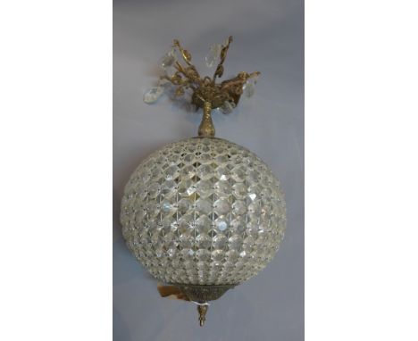 A contemporary gilt metal ceiling light with glass droplet decoration. 