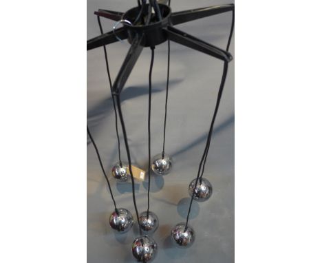 A seven chrome ball hanging light. 