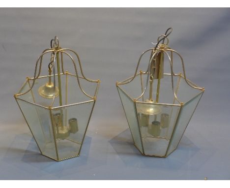 A pair of Italian designer three light gilt metal ceiling lanterns with bevelled glass panels