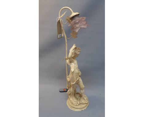 An early 20th century white painted cast metal table lamp in the form of a putto, with pink glass floral shade, H. 74cm