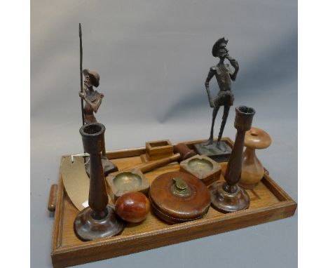 An early 20th century oak smokers tray with two ashtrays and match stick holder together with two treen figures, pair of cand