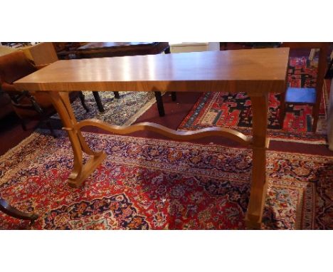 A Contemporary oak console table, raised on trestle base, H. 84cm W. 150cm D. 40cm