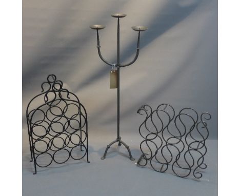 Two wrought iron wine racks together with a wrought iron pricket stick 