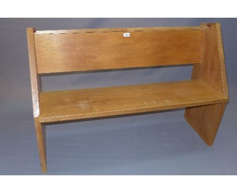 A 20th Century light oak pew with two hinged lid compartments, H:80cm W:114cm D:54cm