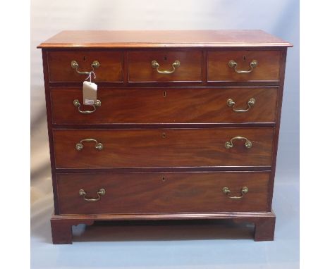 A Georgian style mahogany chest of three short over three long draws raised on carved bracket feet. H- 98cm W- 109cm D- 52cm 