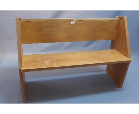 A 20th Century light oak pew with two hinged lid compartments, H:80cm W:114cm D:54cm