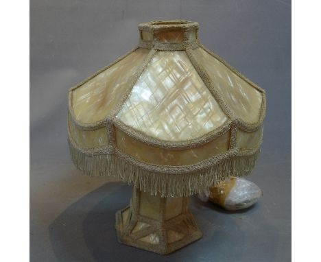 A 1970's Biba table lamp, the fringed marbled xylonite shape above the marbled xylonite base, with Biba label to base, H:47cm