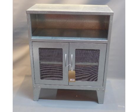 An industrial side cabinet having two mesh doors rasied on bracket feet. H- 85cm W- 66cm D- 35cm 