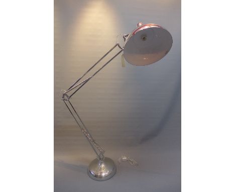 A contemporary chrome angle poise standard lamp