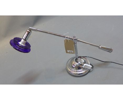 A chrome desk lamp