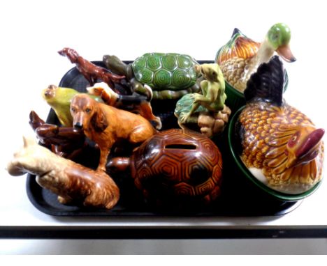 A tray containing assorted ceramic animal figures to include Poole squirrel, Coalport setter, tortoise money boxes, hen and d