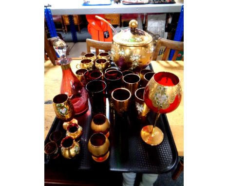 A Victorian style ruby glass decanter with stopper together with a quantity of Bohemian glassware to include lidded punch bow