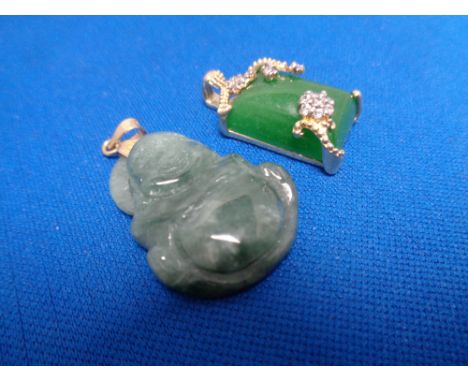 A Chinese hardstone pendant together with a sterling silver Chinese pendant (2) 