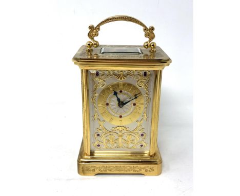 A 20th century Swiss gilt metal cased carriage clock, the movement signed Igor Carl Faberge, Eleven Jewels, Unadjusted, Swiss