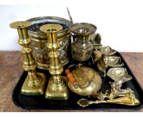 A tray containing antique and later brass ware to include pair of 19th century candlesticks, horse and cart, embossed cherub 