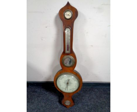 An antique mahogany barometer  