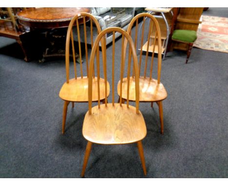 A set of three Ercol solid elm and beech high backed dining chairs (as found)