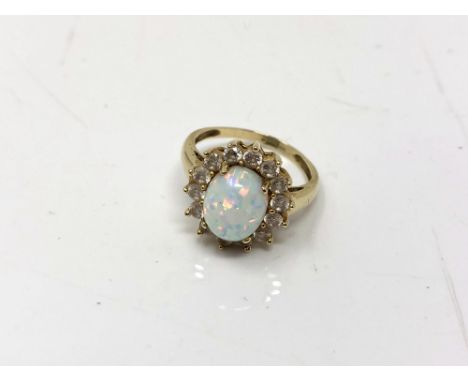 A 9ct gold opal cluster ring, size O.  CONDITION REPORT: 4.5g