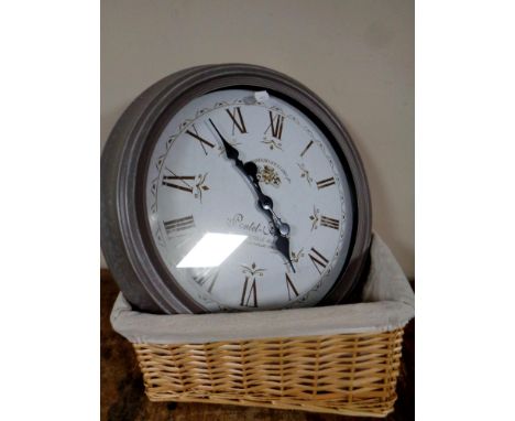A battery operated French style wall clock and a picnic basket 