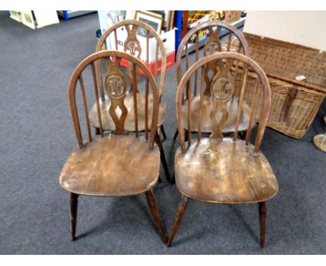 A set of four Ercol Windsor dining chairs 