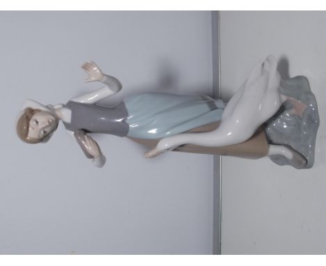 A Lladro figure of a girl with a goose 23cm high