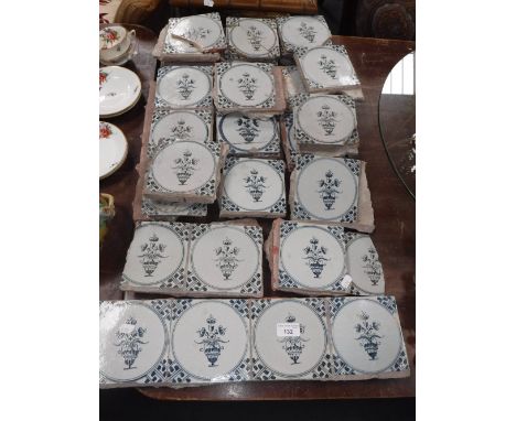 A SET OF THIRTY EIGHT DELFTWARE TILES with blue and white painted decoration of flowers in urns, with some damage, 18th centu