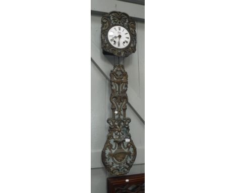 A LATE 19TH CENTURY FRENCH MORBIER / COMTOISE CLOCK with enamel dial, embossed and coloured brass surround, and large embosse