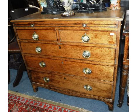 A GEORGE III LIGHT OAK CHEST OF DRAWERS fitted a brushing slide, 37" wide