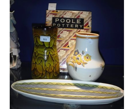 A POOLE POTTERY VASE decorated with yellow flowers, a similar 1950's tray, another vase and a volume 'Poole Pottery' by Haywa