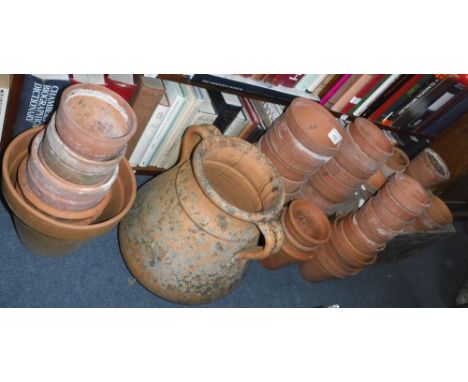 A TERRACOTTA TWO HANDLED AMPHORA STYLE PLANTER AND A LARGE QUANTITY OF VINTAGE TERRACOTTA FLOWERPOTS , and a wooden 'Black & 