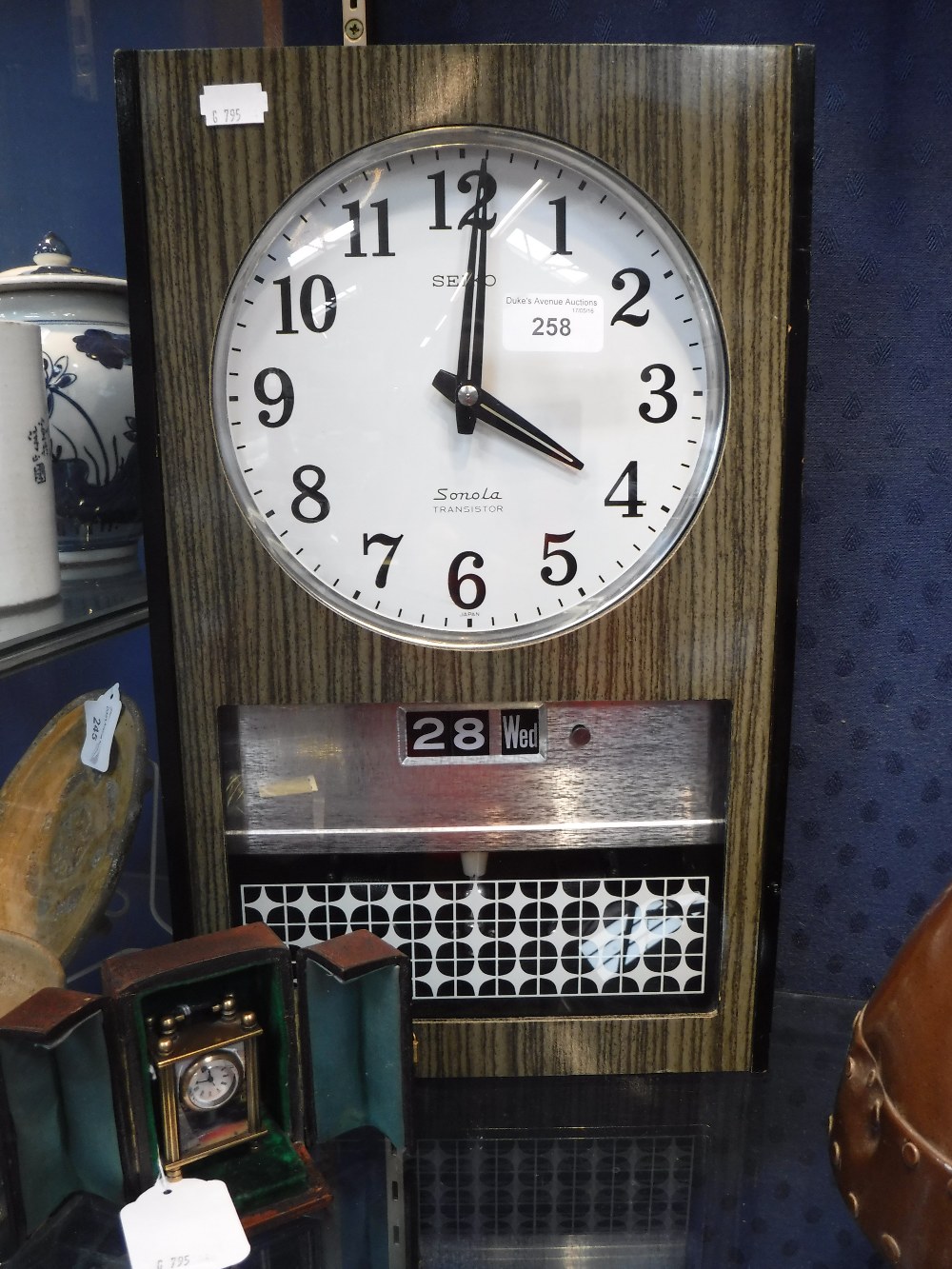 A 1960'S SEIKO SONOLA TRANSISTOR WALL CLOCK and a miniature carriage clock